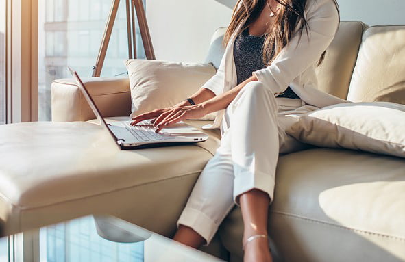 People working on laptops, representing home network security.