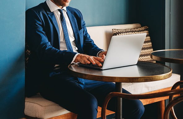 Man working diligently, representing concierge service.